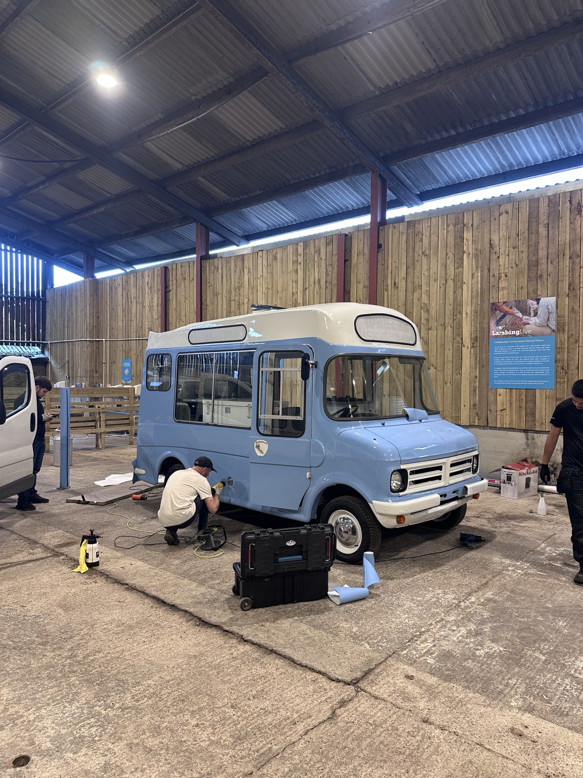 A restored blue Bedford CF being prepared for a bespoke wrap